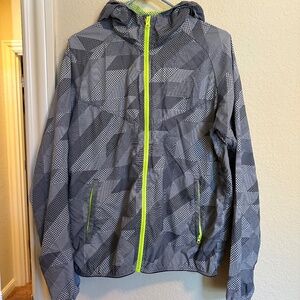 Nike hooded windbreaker - Gray geometric print with neon lining.  Size Medium.